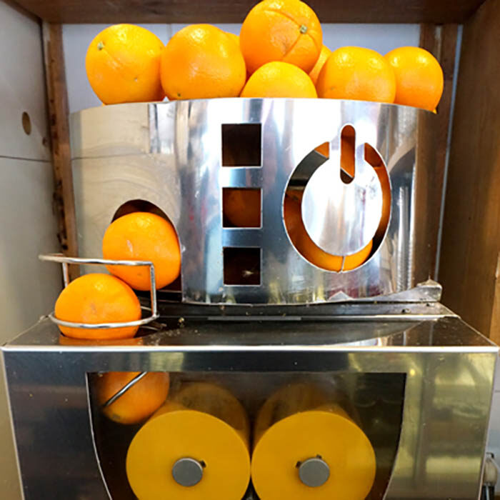 bennisons-bakery-orange-juice Picture of oranges on top of juicer